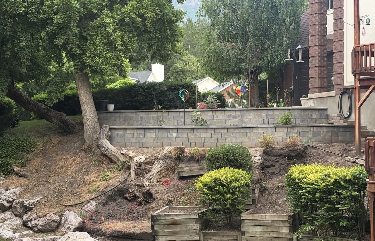 Eroded single tier slope before Elite Landscapes terraced wall build