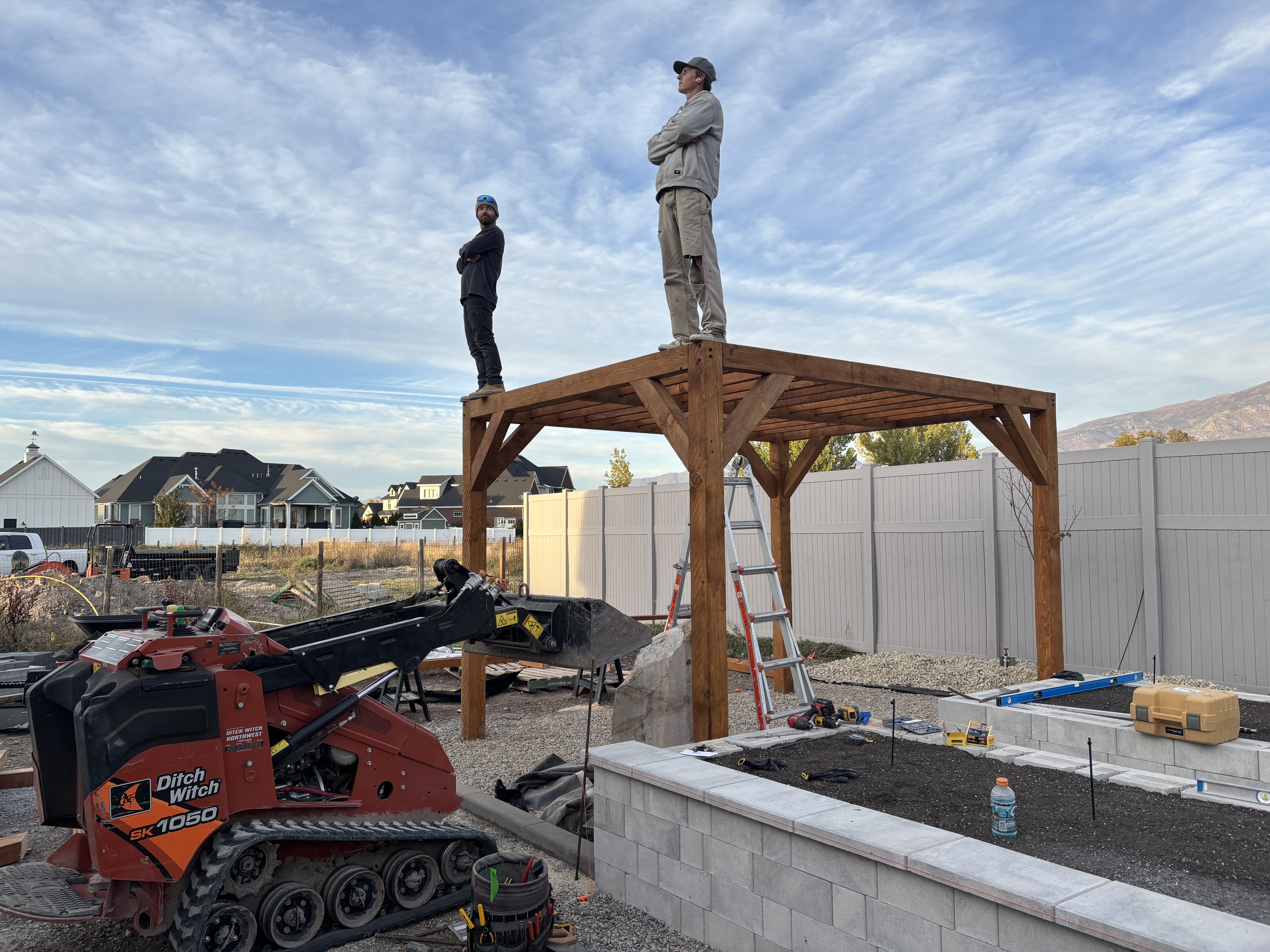 Elite Landscapes UT crew on site, building a custom pergola