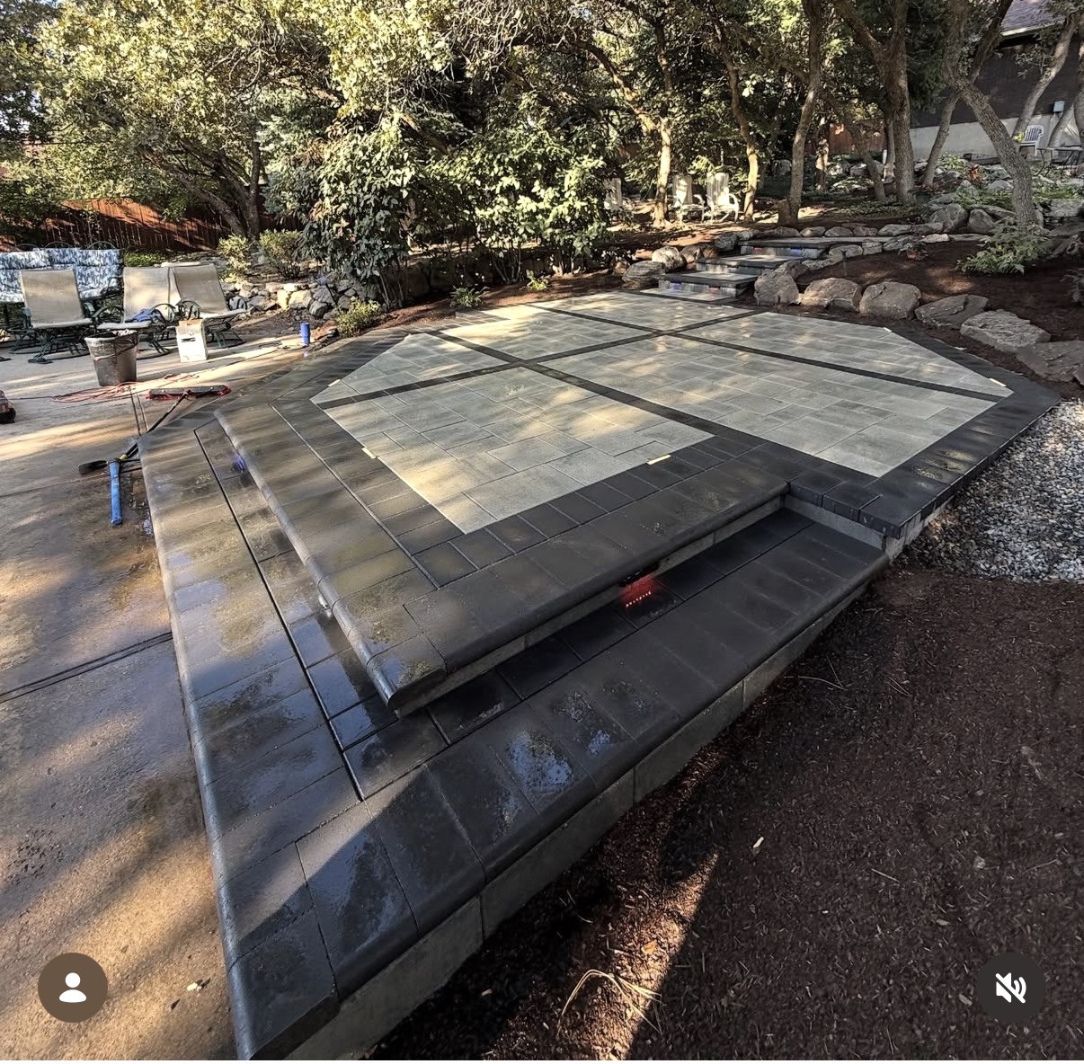 Dark paver patio with step and coping