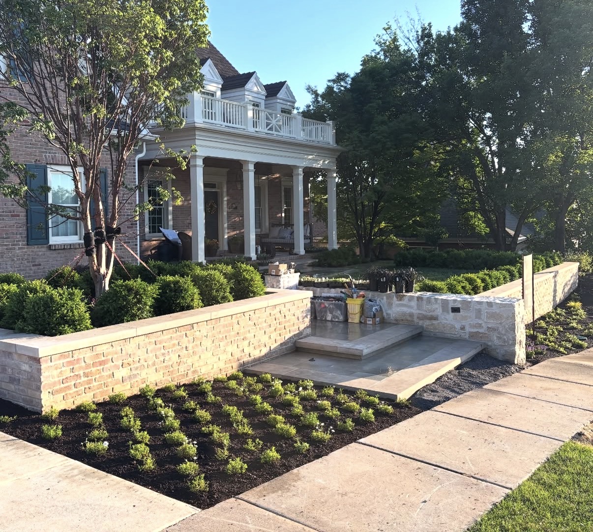 Brick planter walls and fresh planting on high end Utah estate