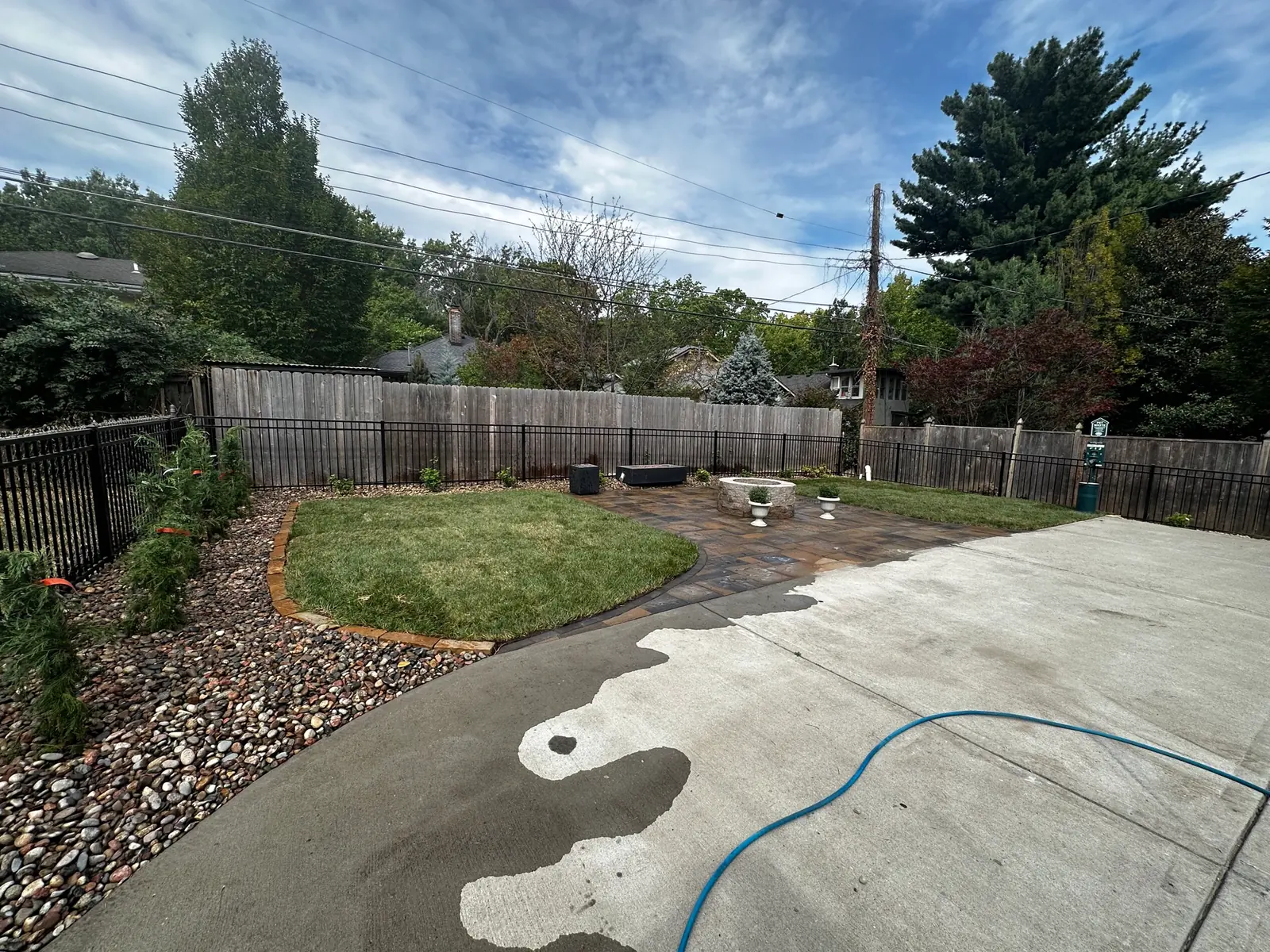 Backyard lawn and river rock bed