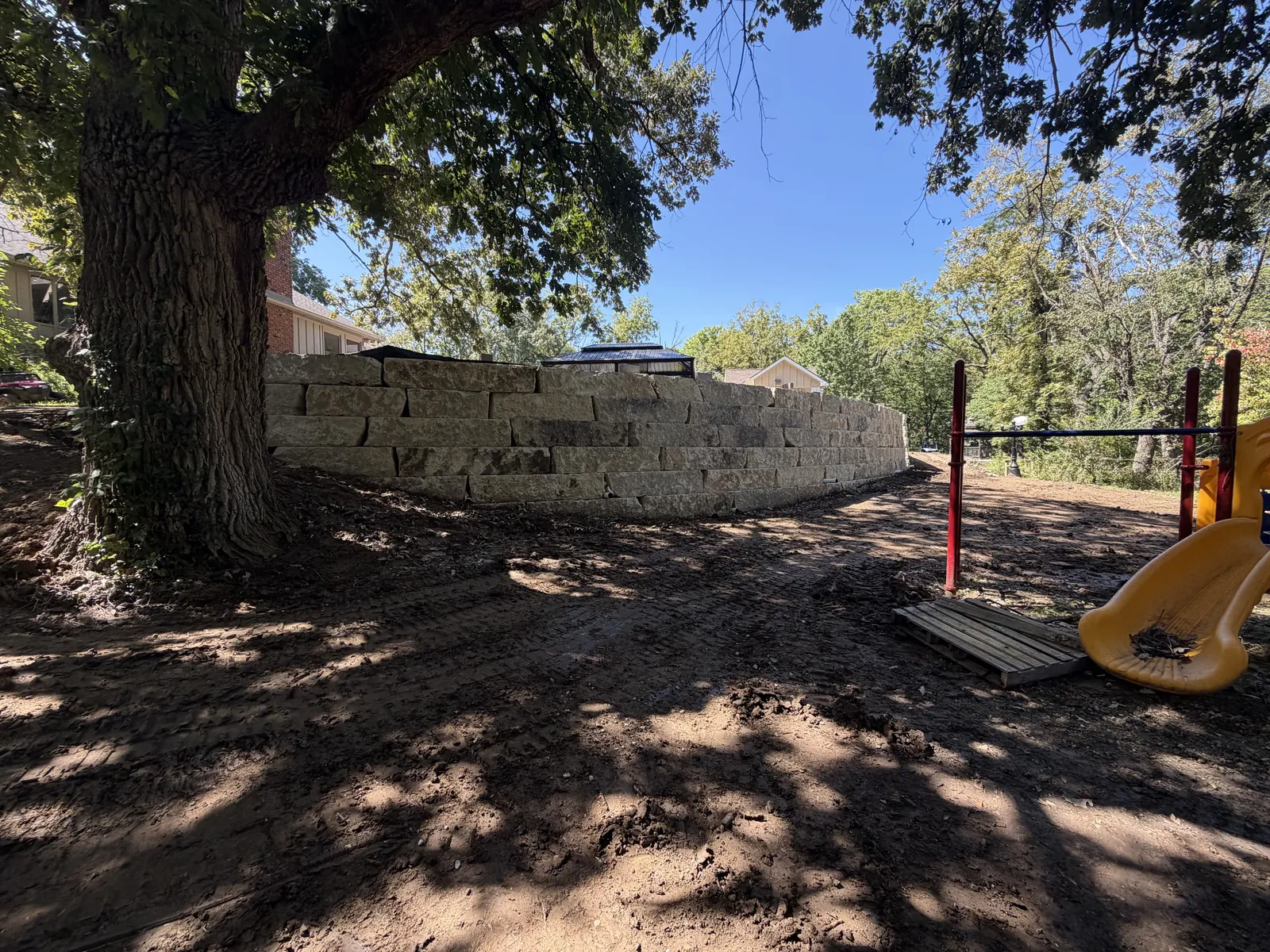 Long limestone boulder retaining wall